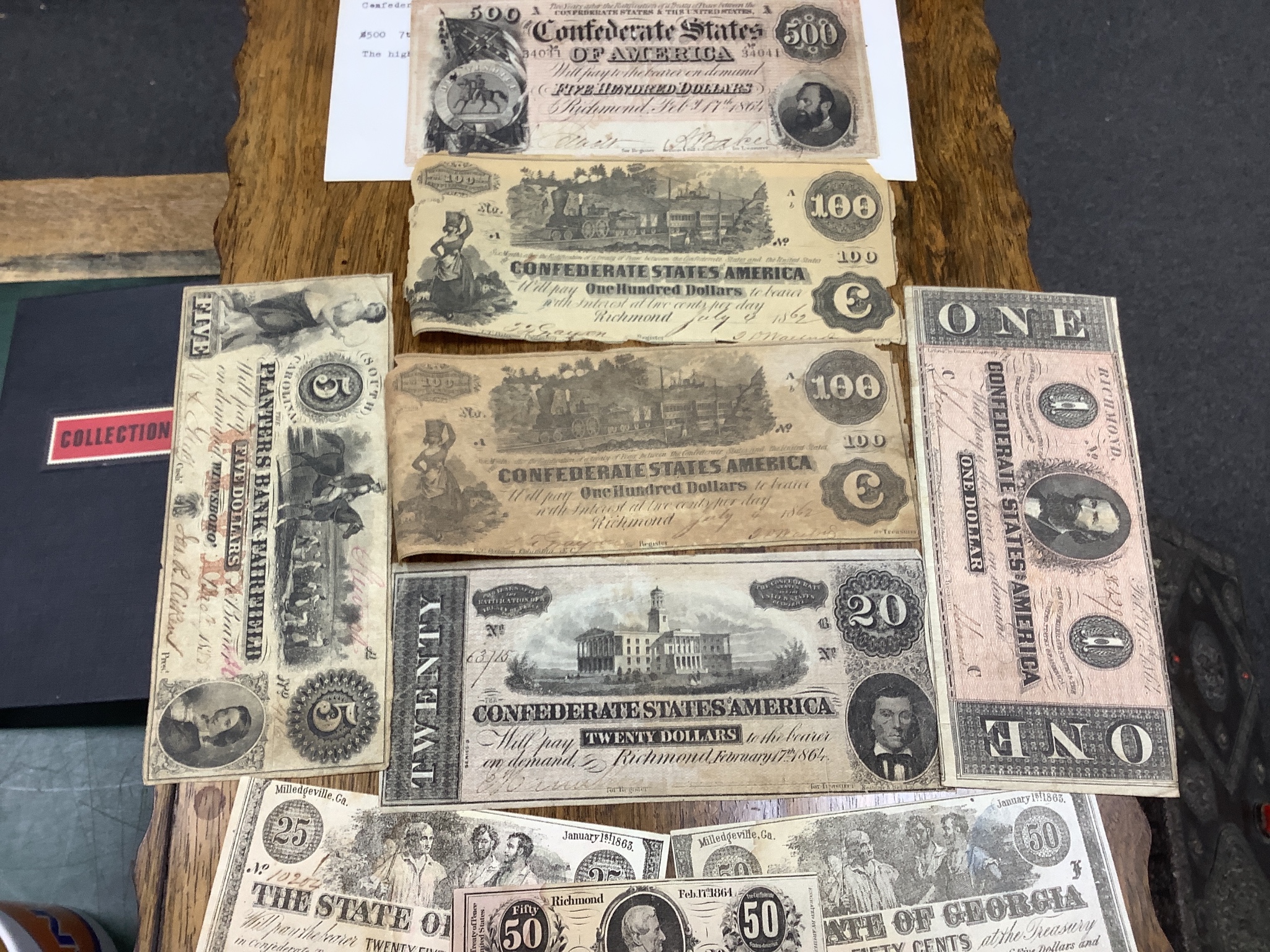 A collection of US Confederate States banknotes, including a confederate states of America $500 seventh issue 17 February 1864, $100 Richmond July 4 1862 x 2 and another 1864, and many others